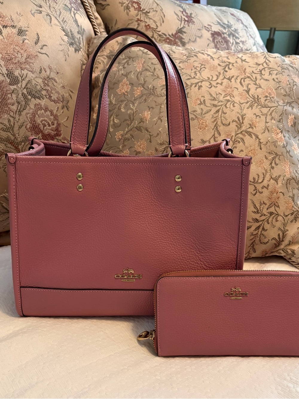 Coach True Pink Leather Dempsey Carryall with matching with matching wallet.